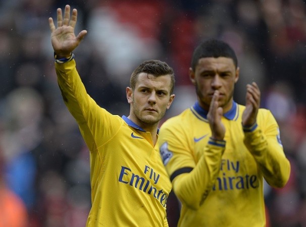 Jack Wilshere and Alex Oxlade-Chamberlain wave to the supporters after their humiliating 5-1 defeat to Liverpool, 8 February. Reuters Wilshere, Oxlade-Chamberlain Arsenal