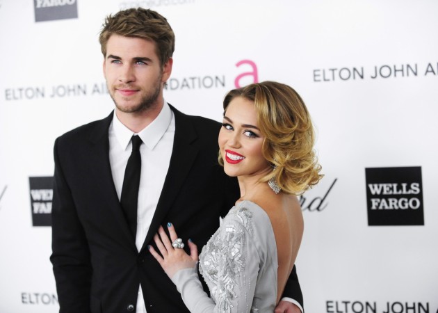 In this picture, Miley Cyrus (R) and Liam Hemsworth arrive at the 20th annual Elton John AIDS Foundation Academy Awards Viewing Party in West Hollywood, California February 26, 2012 Miley Cyrus