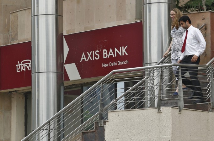 People use a staircase next to a corporate branch office of Axis Bank in New Delhi July 18, 2013. Axis Bank