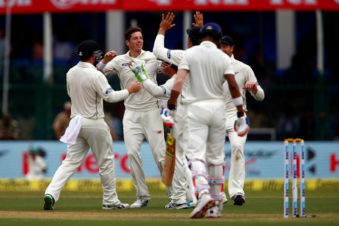Mitchell Santner celebrates with teammates after picking up the wicket of KL Rahul Mitchell Santner New Zealand