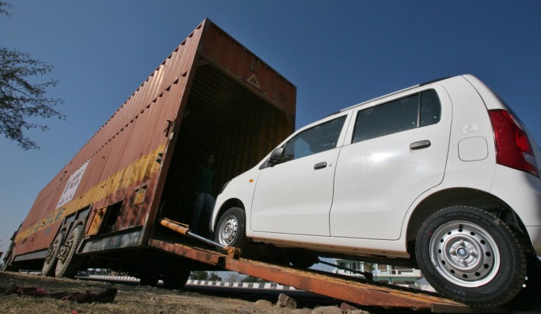 Maruti Suzuki exports reach the 15 lakh mark. Pictured: A worker unloads an A-Star car from a container at a Maruti Suzuki stockyard . Maruti Suzuki exports touch 15 lakh marks. Pictured: A worker unloads an A-Star car from a container at a Maruti Suzuki stockyard .