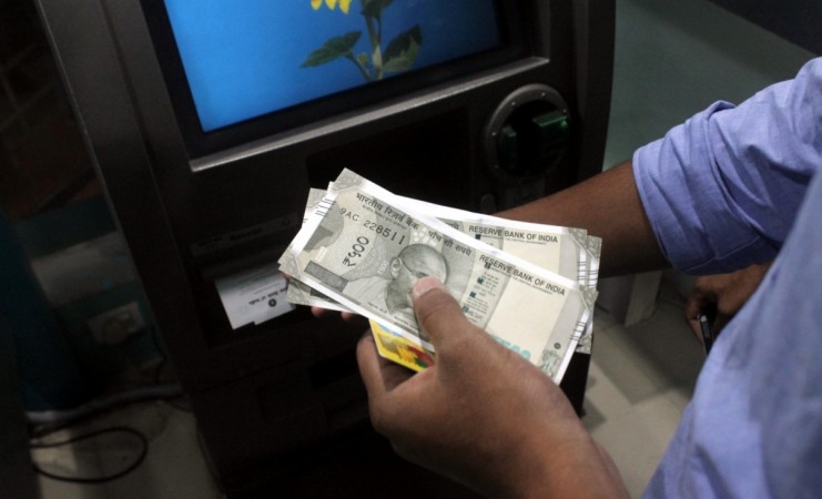 How do you withdraw money from an ATM?