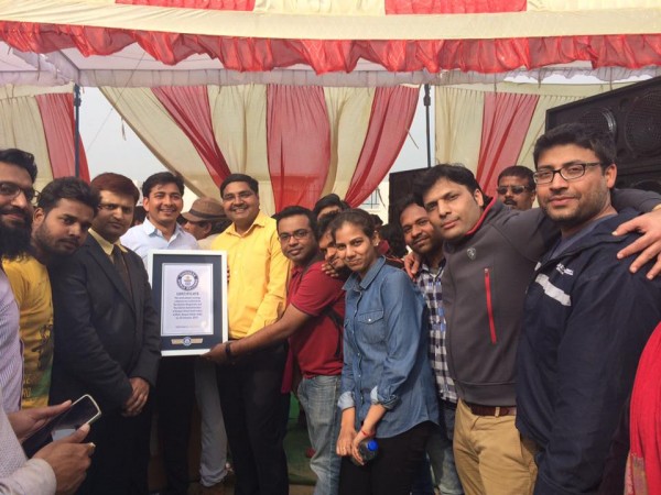 The Guinness World Record certificate is being awarded for the record of most people carrying a banner. Guinness World Record
