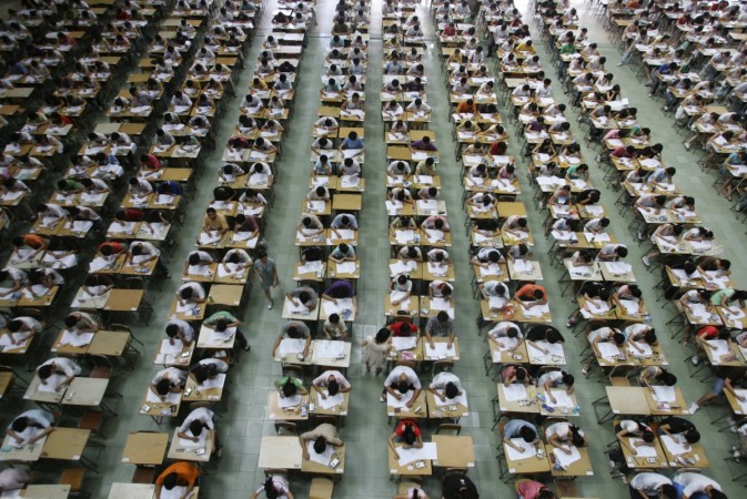 Students take their examination in an exam hall. Reuters