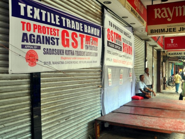 Parakh Kothi Traders Association observe a bandh by closing their shops in protest against the implementation of GST in Kolkata on June 27, 2017. gst rate on tour operator, gst rate on textiles, textile industry, tourism industry