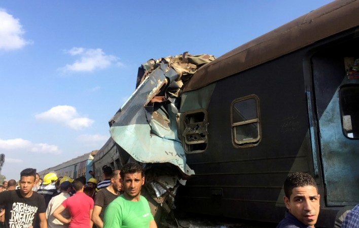 Egyptians look at the crash of two trains that collided near the Khorshid station in Egypt's coastal city of Alexandria, Egypt August 11, 2017. Egypt
