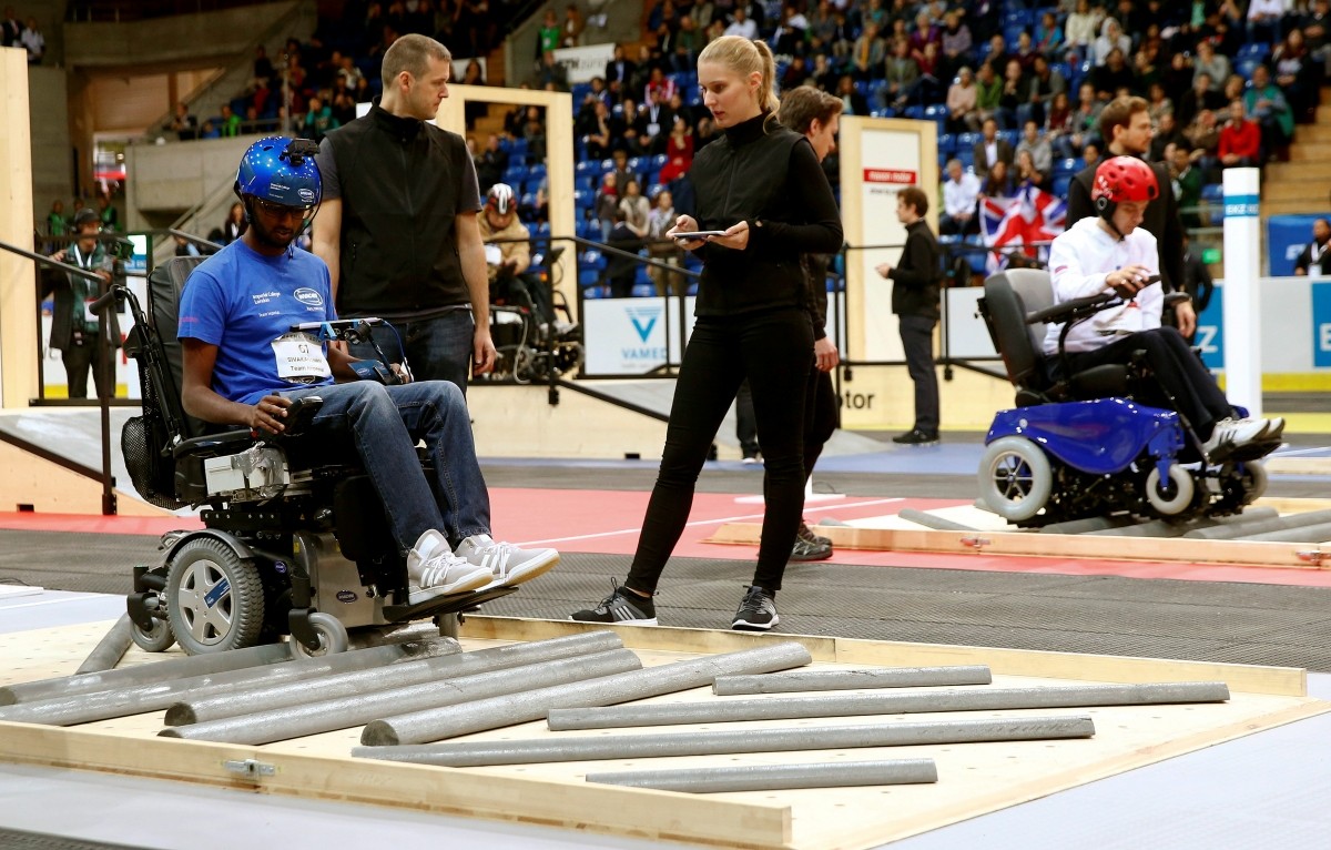 Britain's Sivashankar Sivakanthan and Yuri Larin (R) of Russia compete during the Powered Wheelchair Race at the Cybathlon Championships in Kloten, Switzerland October 8, 2016.