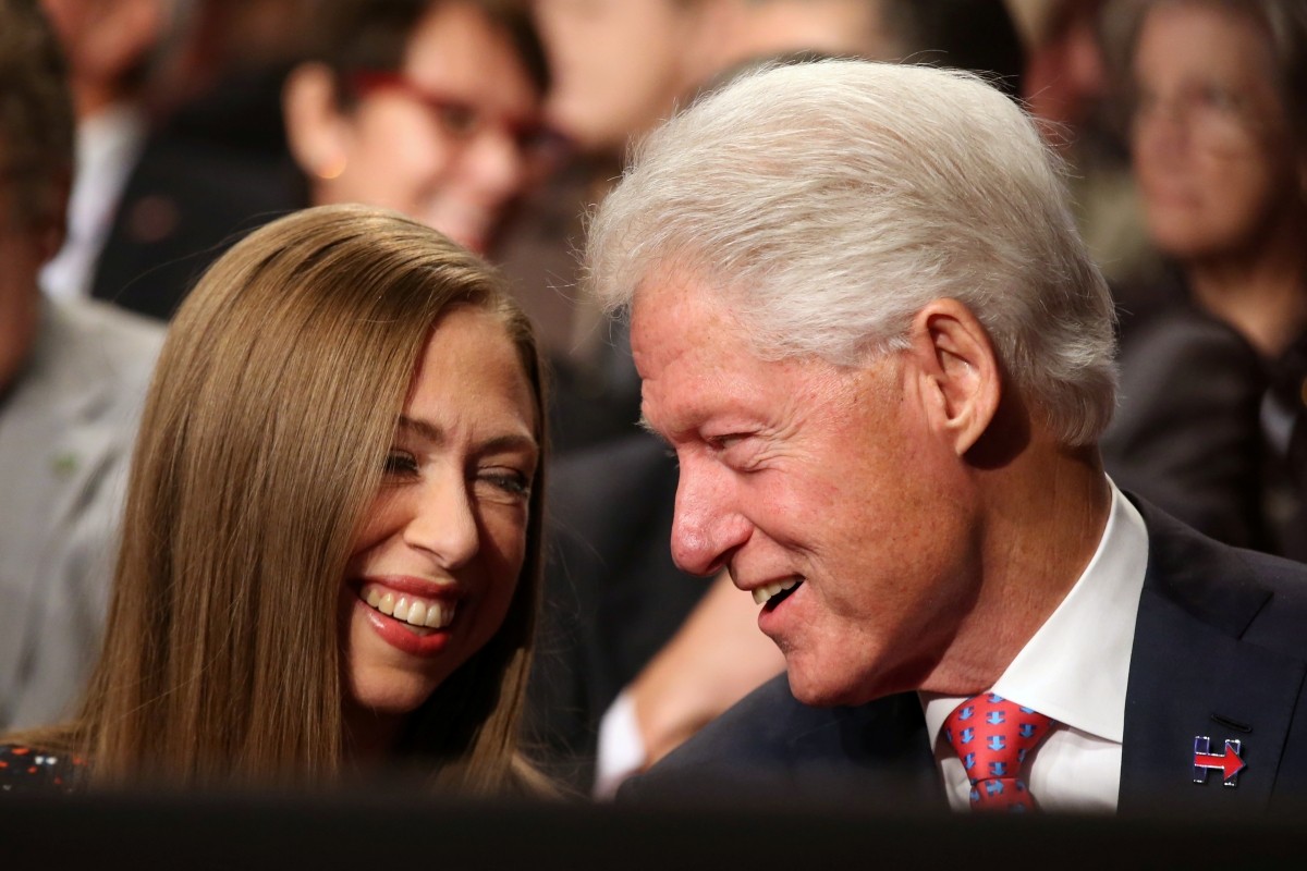 Former U.S. President Bill Clinton (R) talks with his daughter Chelsea Clinton prior to the third and final 2016 presidential campaign debate between Republican U.S. presidential nominee Donald Trump and Democratic U.S. presidential nominee Hillary Clinton at UNLV in Las Vegas, Nevada, U.S., October 19, 2016.