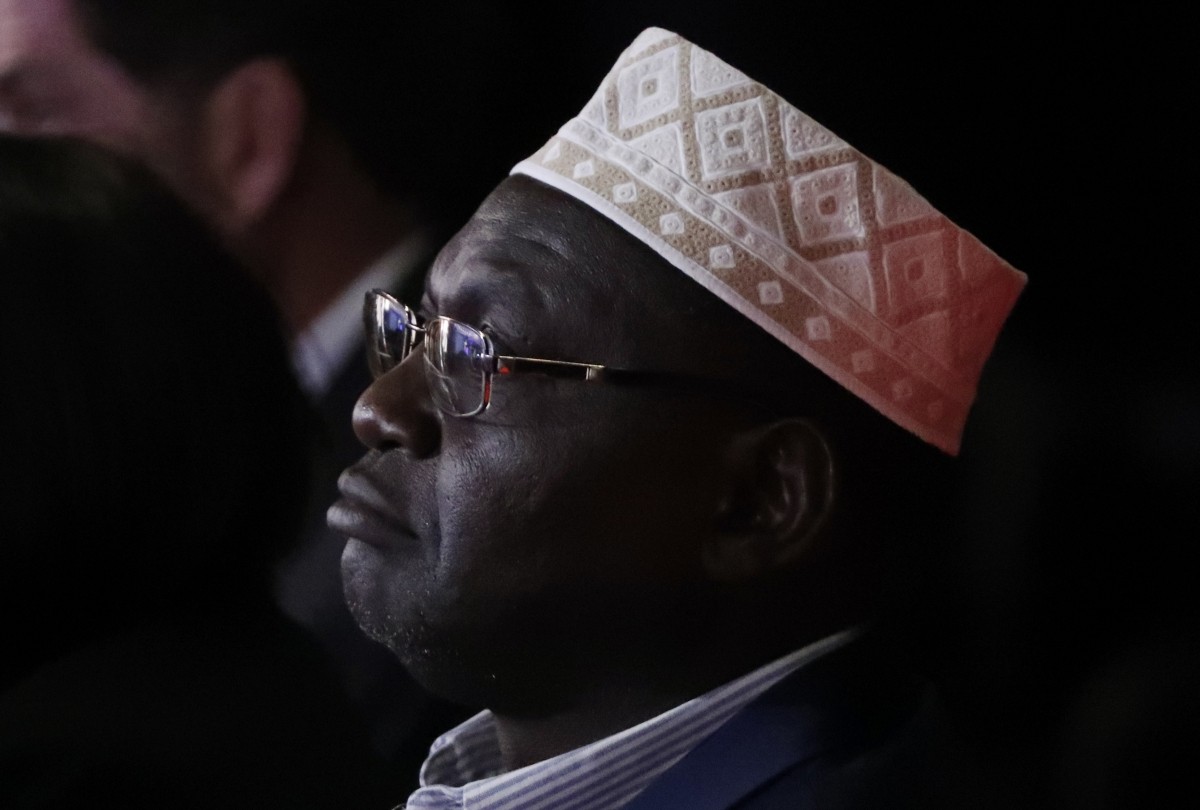 President Barack Obama's half brother Malik, a guest of Donald Trump, sits in the crowd.