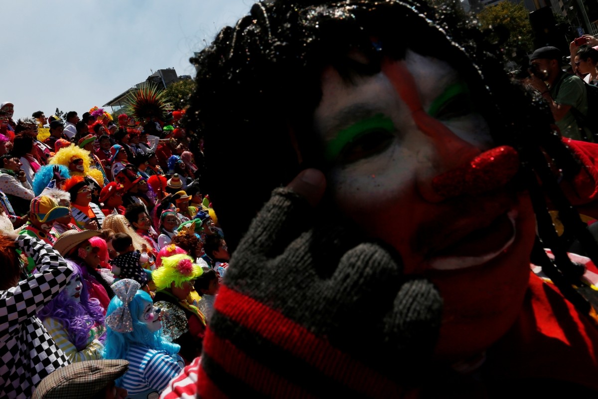 Clowns poses for the annual picture as part of the XXI Convention of Clowns, at the Monument to the Revolution, in Mexico City, Mexico, October 19, 2016.