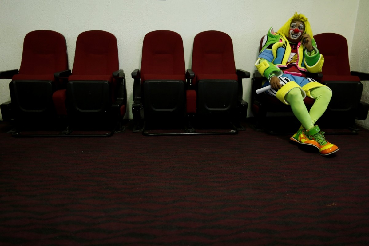 A clown rests during the XXI Convention of Clowns, at the Jimenez Rueda Theatre, in Mexico City, Mexico, October 19, 2016.