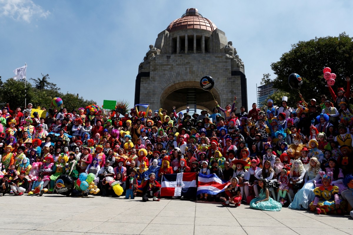 Clowns pose for the annual picture as part of the XXI Convention of Clowns, at the Monument to the Revolution, in Mexico City, Mexico, October 19, 2016.