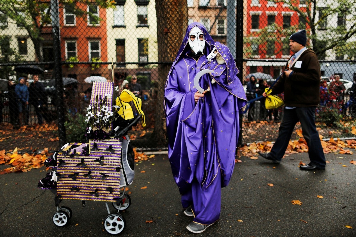 A reveller takes part in the annual halloween dog parade at Manhattan's Tompkins Square Park in New York, U.S. October 22, 2016.