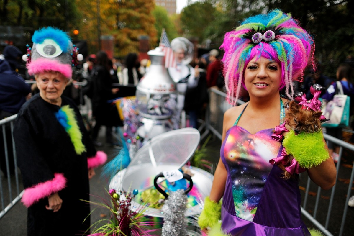 Revellers take part in the annual halloween dog parade at Manhattan's Tompkins Square Park in New York, U.S. October 22, 2016.