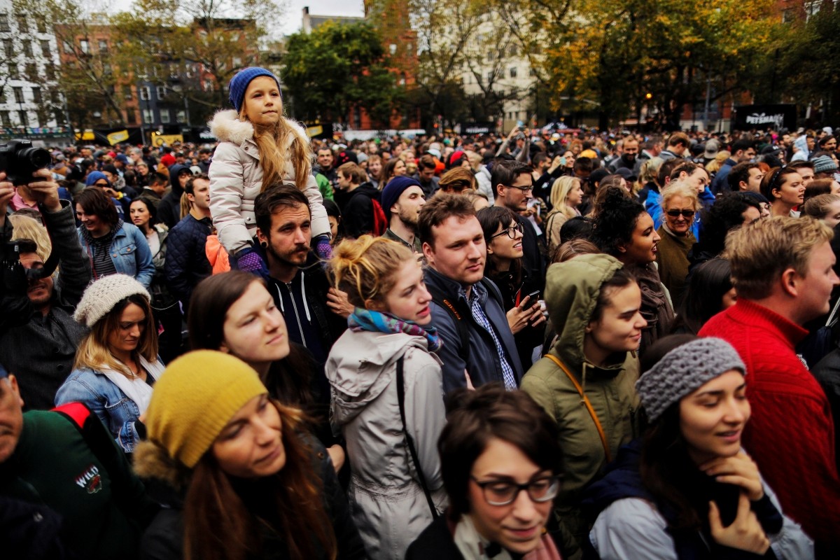 People attend the annual halloween dog parade at Manhattan's Tompkins Square Park in New York, U.S. October 22, 2016.