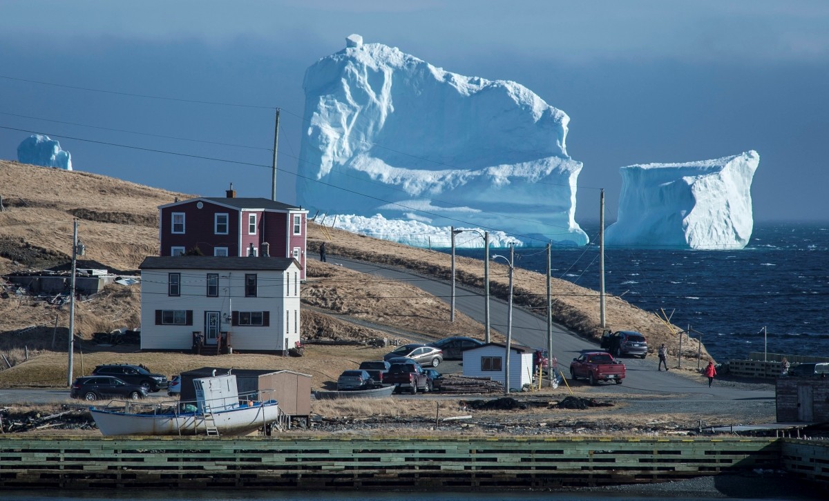 Residents view the first iceberg of the season as it passes the South Shore of Newfoundland. Canada ice berg