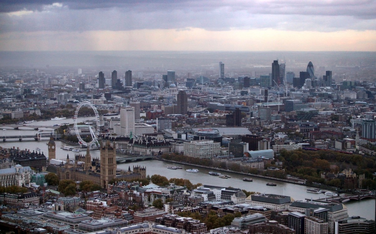 An aerial view of London featuring the Houses of Parliament, the London Eye Ferris wheel and the financial district on November 4, 2009 in London, England. London