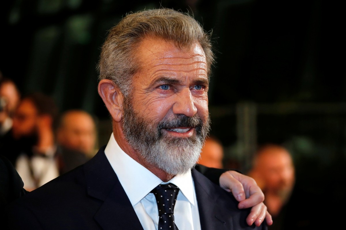 Cast member Mel Gibson poses on the red carpet as he arrives for the screening of the film mel gibson
