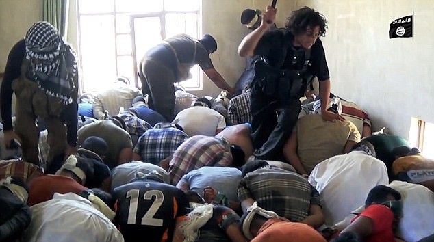 Isis militants can be seen hitting the captives with sticks ISIS shooting