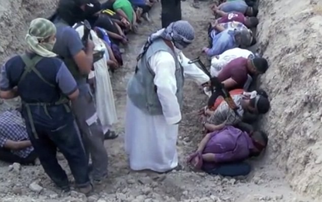 A screenshot of the Isis propaganda video shows militants pointing guns at the captives in a trench. ISIS shooting