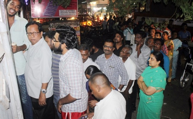 People wait to withdraw money from ATM even at night People wait to withdraw money from ATM even at night