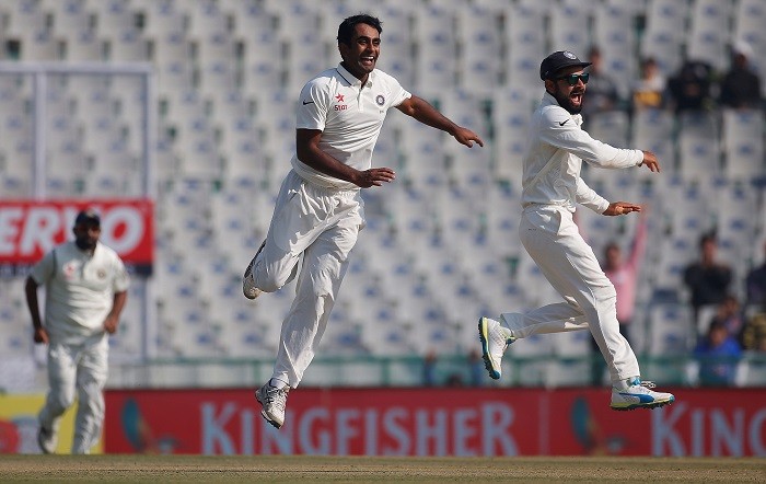 India off-spinner Jayant Yadav and captain Virat Kohli celebrate the wicket of England batsman Joe Root, November 26, 2016 Jayant Yadav Virat Kohli India
