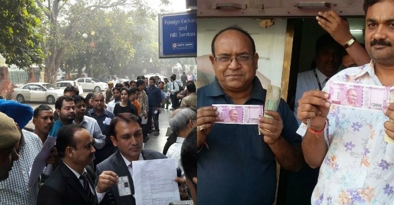 People pose with the new Rs 2000 note.