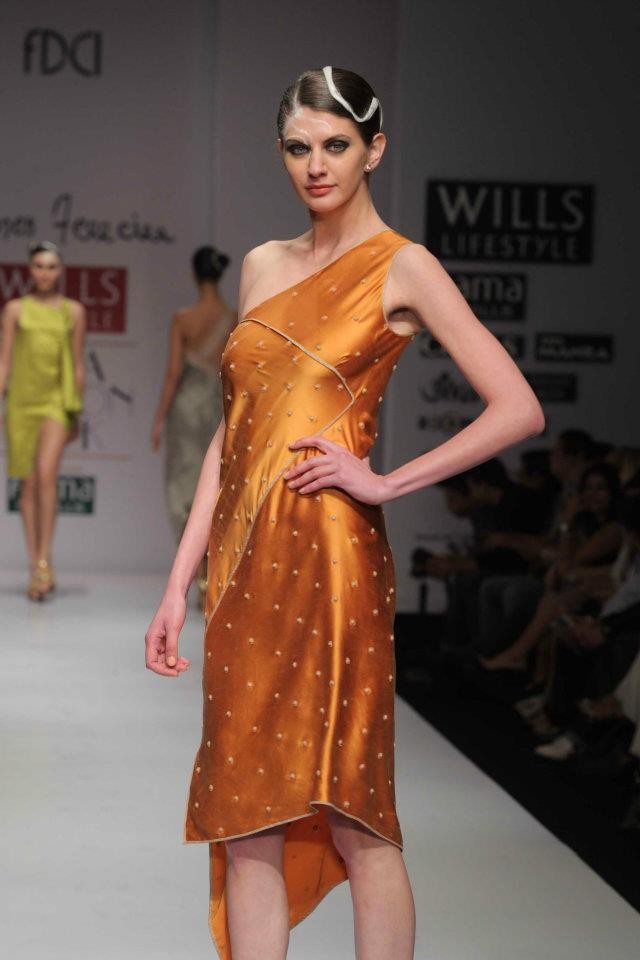 A model walks the ramp during the fourth day of the ongoing Wills Lifestyle India Fashion Week -2012 in New Delhi. Day 4 WIFW