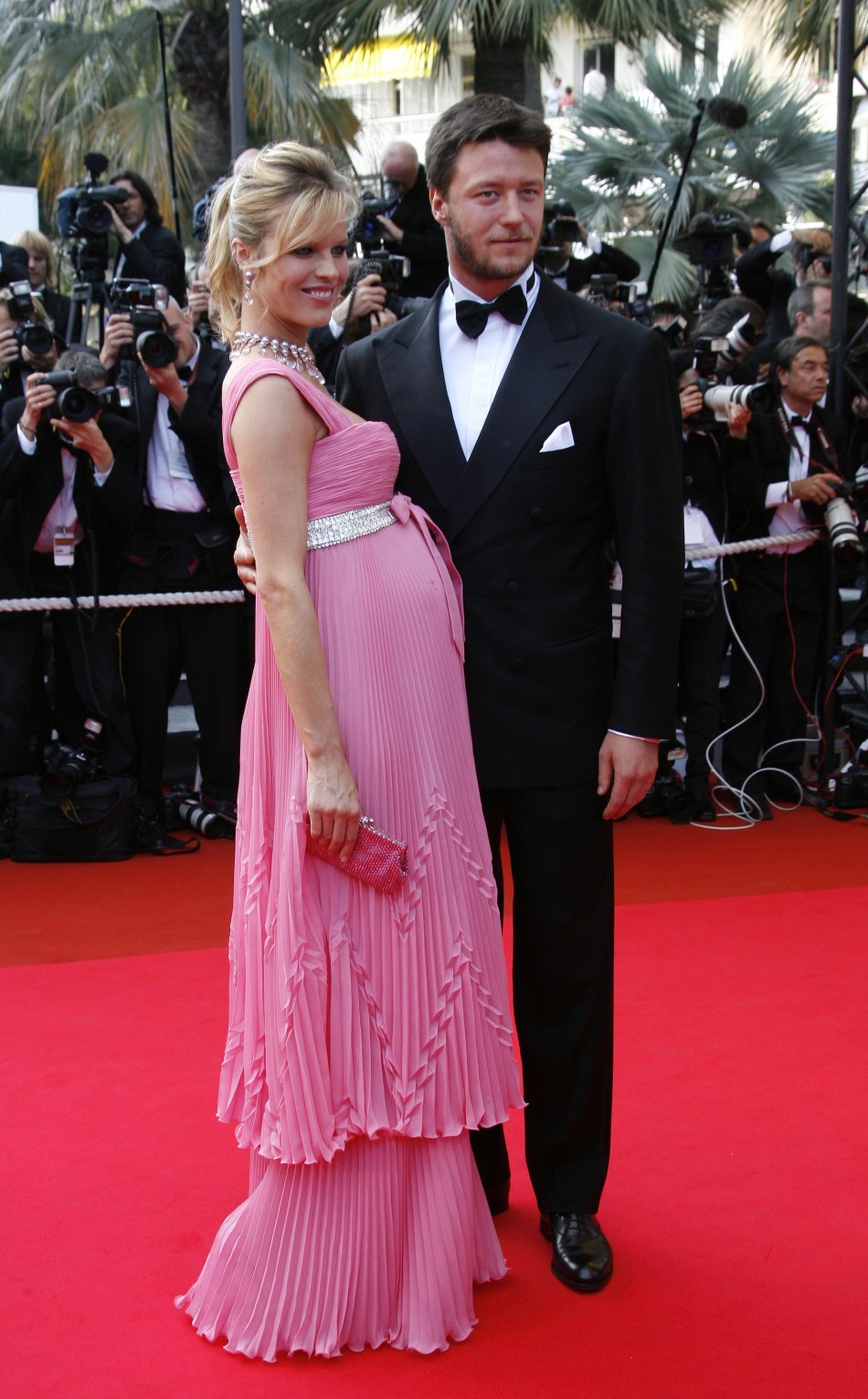 Czech supermodel Eva Herzigova and partner Gregorio Marsiaj arrive for the evening gala screening of Chinese director Wong Kar Wai's in-competition film Eva Herzigova