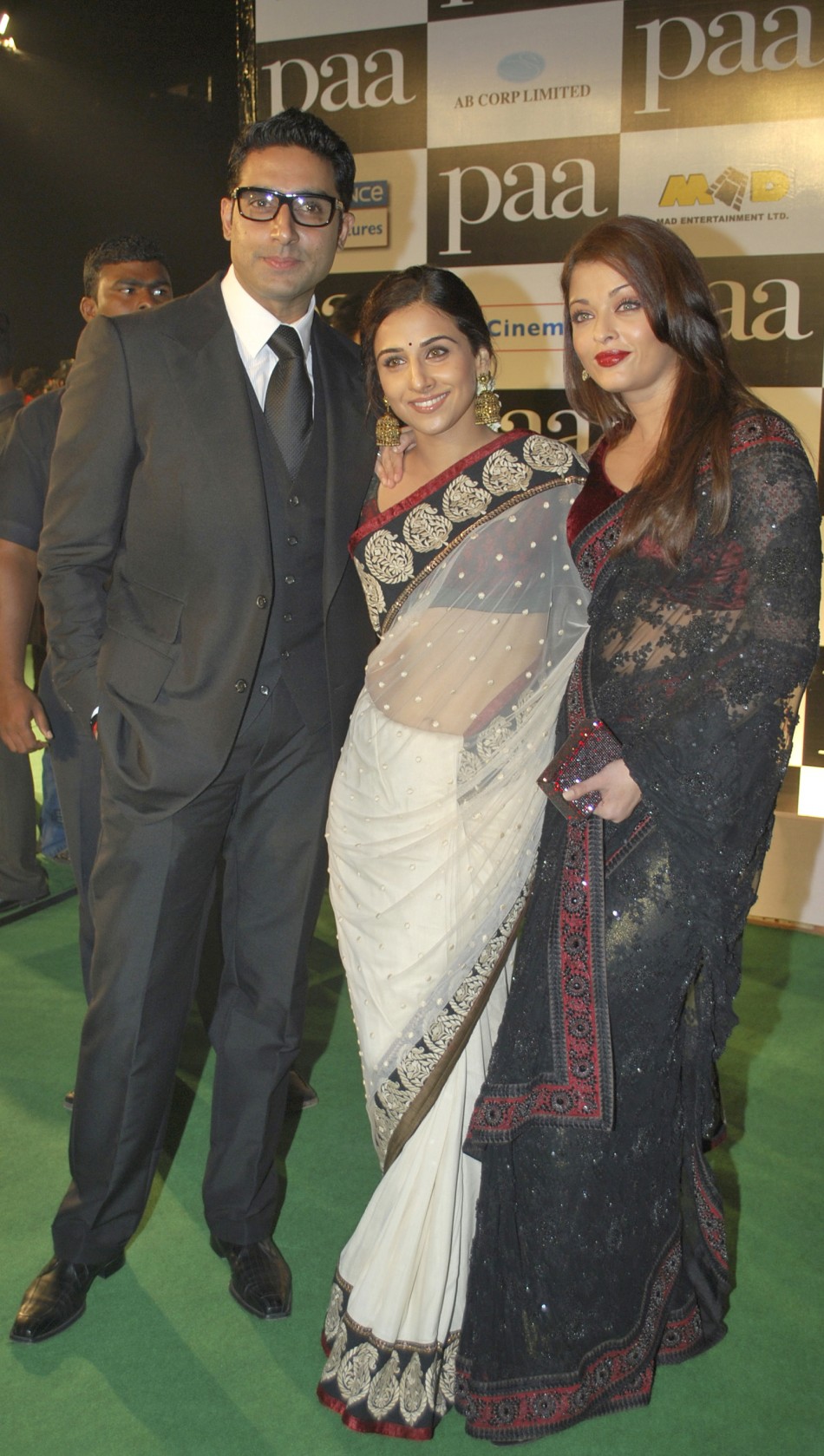 Bollywood actors Abhishek Bachchan (L), his wife Aishwarya Rai Bachchan (R) and Vidya Balan pose for a picture during the premiere of movie Vidya Balan’s Journey to Stardom