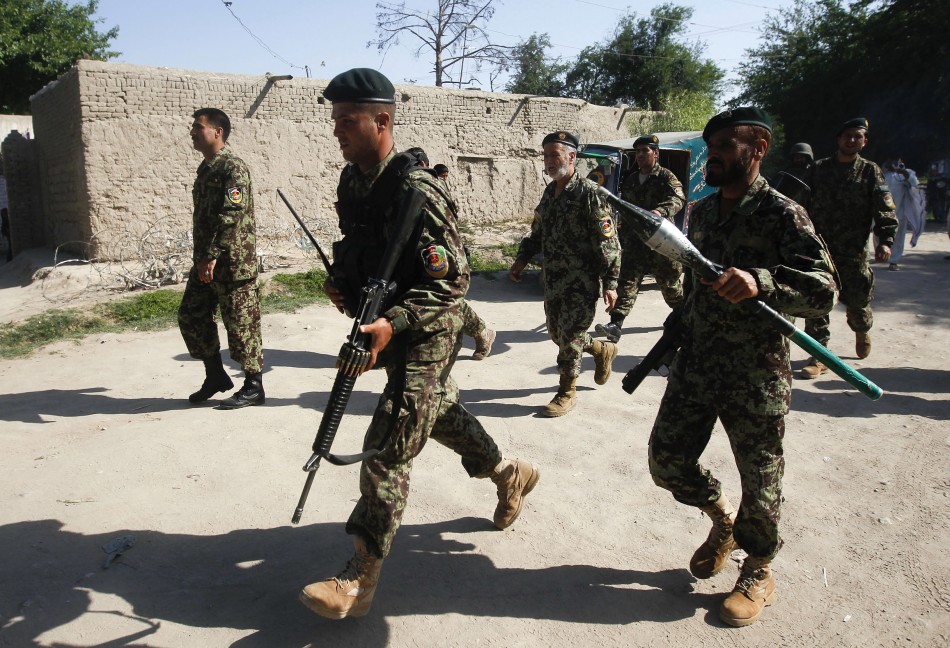Afghan National Army soldiers arrive at the Provincial Reconstruction Team (PRT) after gunmen launched a coordinated attack in Jalalabad province April 15, 2012. Taliban Attack in Kabul