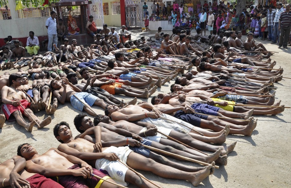 Tribal people and farmers from the eastern Indian state of Jharkhand take part in a prayer ritual believed to bring rain, outside the Hindu Lord Shiva temple in Ranchi May 6, 2012. The India Meteorological Department (IMD) has forecast average rains in 2012. The annual rains are likely to be 99 percent of the long period average, helping India avoid drought for the third year in row. The Week That Was (PHOTOS)