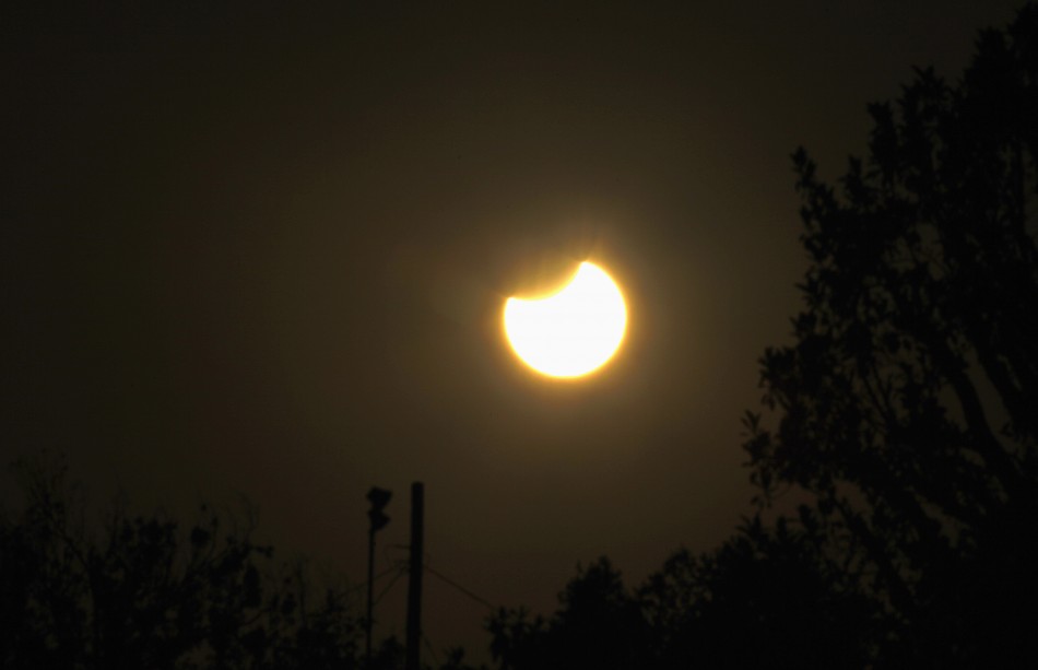 The moon passes between the sun and the earth during a solar eclipse seen from Pasadena Annual solar eclipse