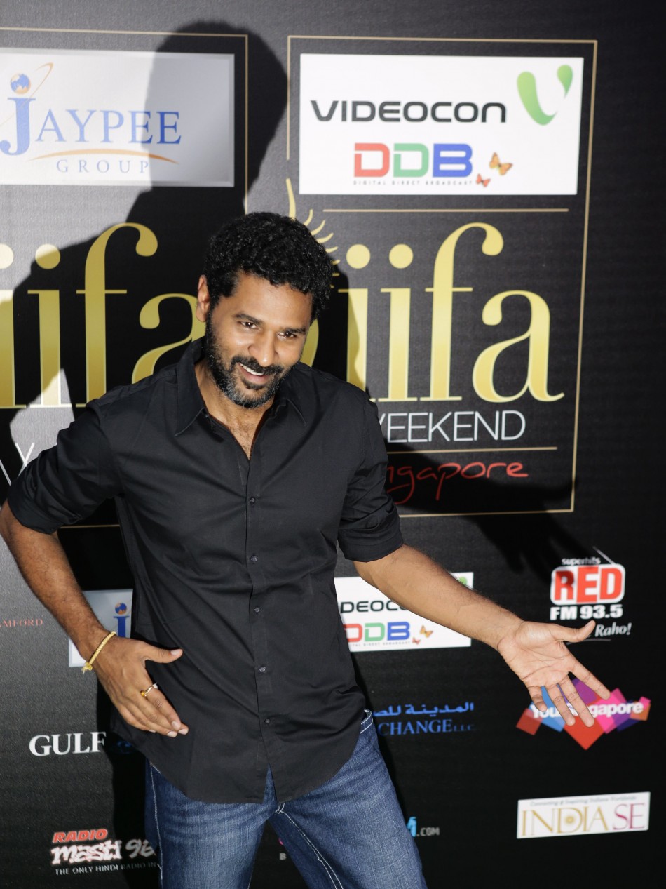 Bollywood dancer Prabhu Deva poses for photos on the green carpet before IIFA Awards show in Singapore IIFA Awards 2012