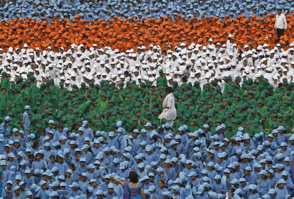 Schoolchildren take part in the Independence Day celebrations in front of the historic Red Fort, where Indian Prime Minister Singh is to address the nation in Delhi Independence Day