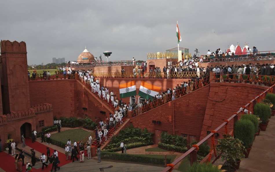 People leave the historic Red Fort after the Independence Day speech by India's PM Singh in Delhi Independence Day
