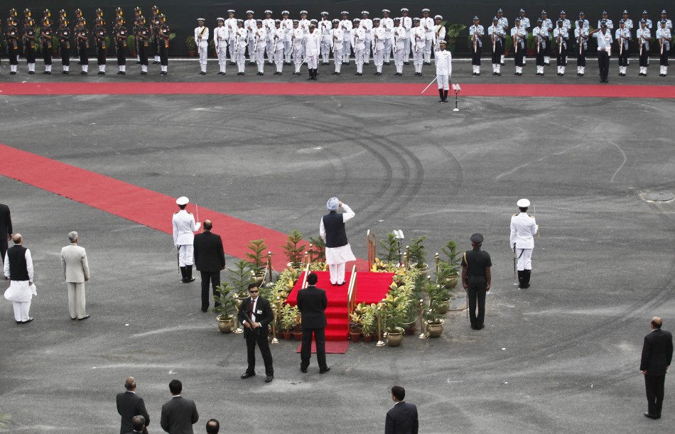India's PM Singh inspects a guard of honour upon his arrival at the historic Red Fort during Independence Day celebrations in Delhi Independence Day