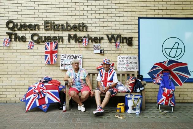 Royal fans sit outside St Mary's Hospital in anticipation of the birth of the Duchess of Cambridge's first baby in London Royal Baby