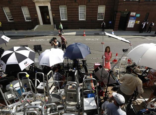 A correspondent speaks outside the Lindo Wing of St Mary's Hospital, where Britain's Catherine, Duchess of Cambridge is due to give birth, in London Royal Baby