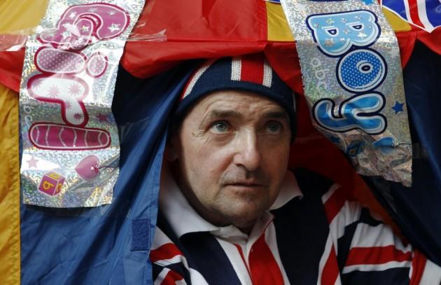 A royal supporter looks out from a tent outside the Lindo Wing of St Mary's Hospital, where Britain's Catherine, Duchess of Cambridge is due to give birth, in London Royal Fan