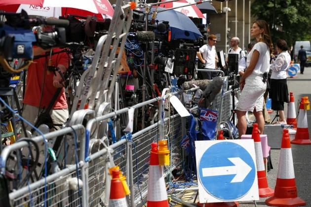 Natalie Morales, a news anchor on NBC's Today show, prepares for a live broadcast opposite the Lindo Wing of St Mary's Hospital, where Catherine, Duchess of Cambridge, is due to give birth, in central London Royal Baby