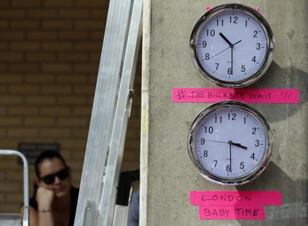 Clocks are seen in the media pen opposite the Lindo Wing of St Mary's Hospital, where Britain's Catherine, Duchess of Cambridge is due to give birth, in London Royal Baby