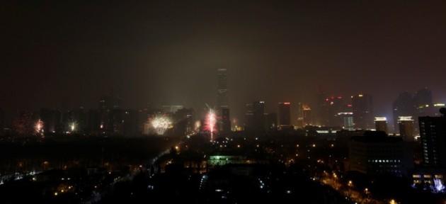 Fireworks explode amid heavy hazy as part of Chinese new year celebrations, in central Beijing early January 31, 2014.REUTERS/Jason Lee Chinese New Year 2014