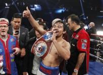 pacquiao-of-the-philippines-celebrates-his-victory-over-bradley-of-the-u-s-after-their-title-fight-at-the-mgm-grand-garden-arena-in-las-vegas