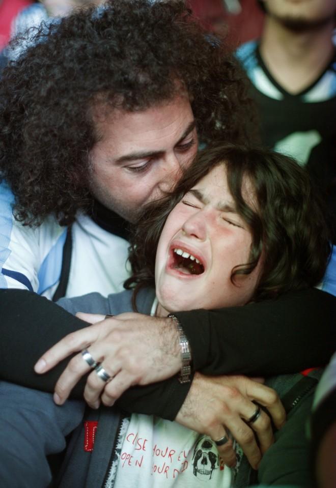Argentina's fans react after Argentina loss to Germany in their 2014 World Cup final soccer match in Brazil, at a public square viewing area in Buenos Aires Argentina Fans