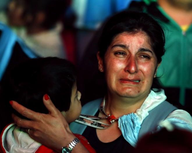 An Argentina fan reacts after Argentina lost to Germany in their 2014 World Cup final soccer match in Brazil, at a public square viewing area in Buenos Aires Argentina fan