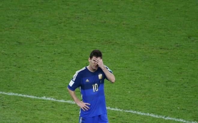 Argentina's Messi reacts after his team being defeated from Germany in their 2014 World Cup final at the Maracana stadium in Rio de Janeiro Lionel Messi