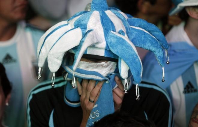 Argentina's fans react after Argentina loss to Germany in their 2014 World Cup final soccer match in Brazil, at a public square viewing area in Buenos Aires Argentina fan