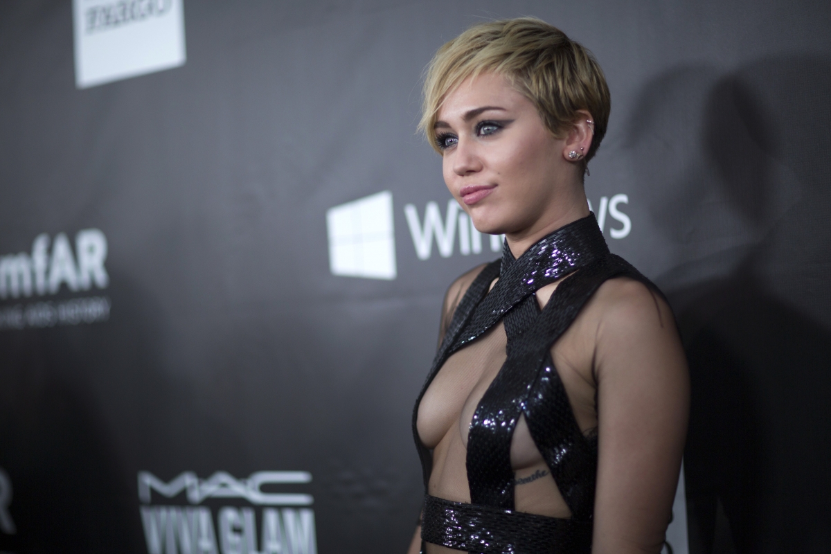 Miley Cyrus Goes Topless on Vacation with Patrick 