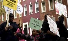 Demonstrators gather in front of Baltimore Police Department Western District in Baltimore, Maryland, April 25, 2015